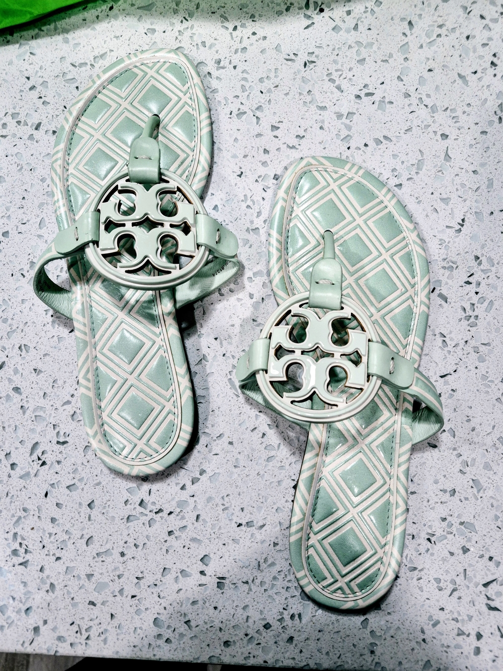 Tory Burch Metal Miller Sandals in the colorway New Ivory / Meadow Mist.